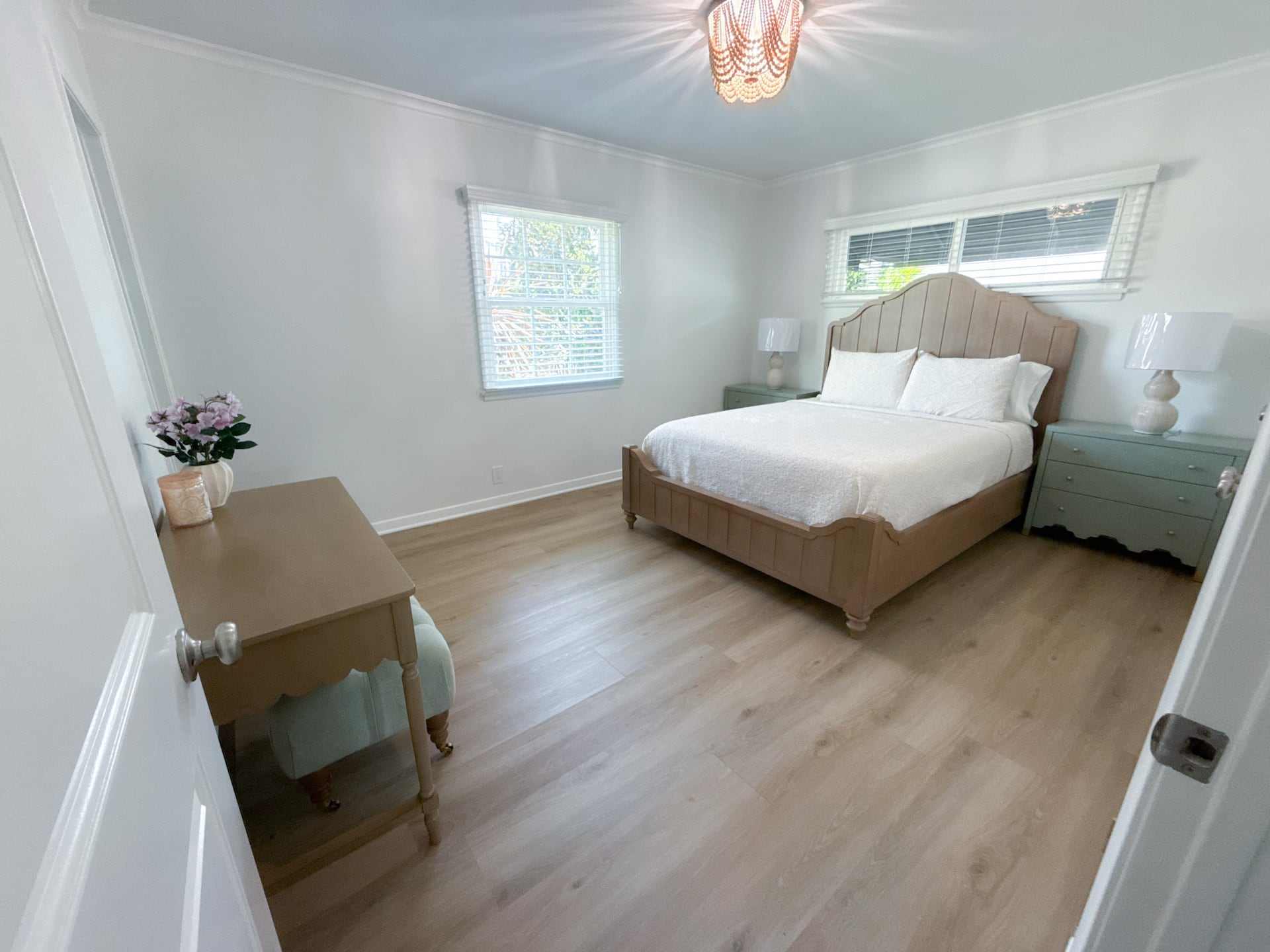 Master bedroom with a queen bed and a desk workspace